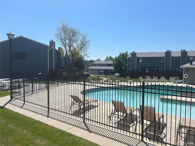 8771 Carr Loop, Arvada, CO 80005 - community pool with a patio and a residential view