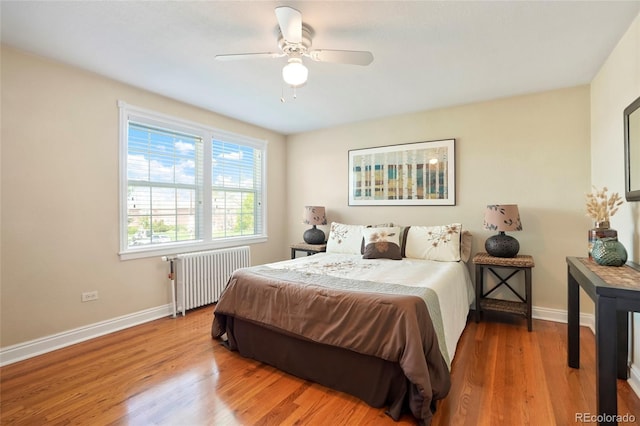 2813 Jasmine St, Denver, CO 80207 - bedroom with radiator heating unit, baseboards, wood finished floors, and ceiling fan
