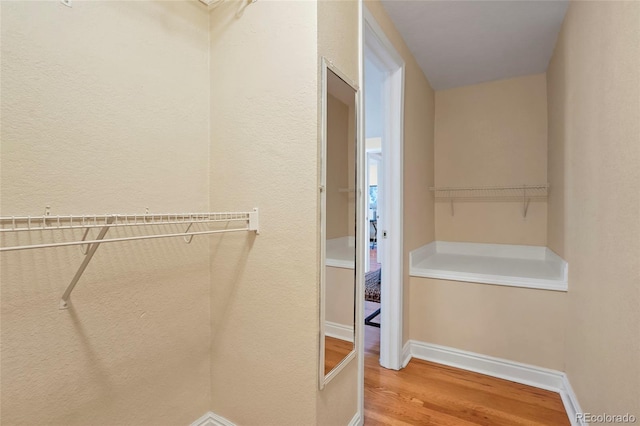 2813 Jasmine St, Denver, CO 80207 - walk in closet featuring wood finished floors