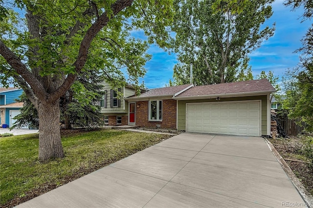 117 Sandler Dr, Lafayette, CO 80026 - split level home featuring an attached garage, concrete driveway, and brick siding