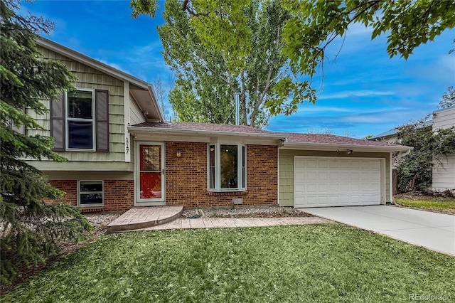117 Sandler Dr, Lafayette, CO 80026 - tri-level home with brick siding, driveway, an attached garage, and a front yard