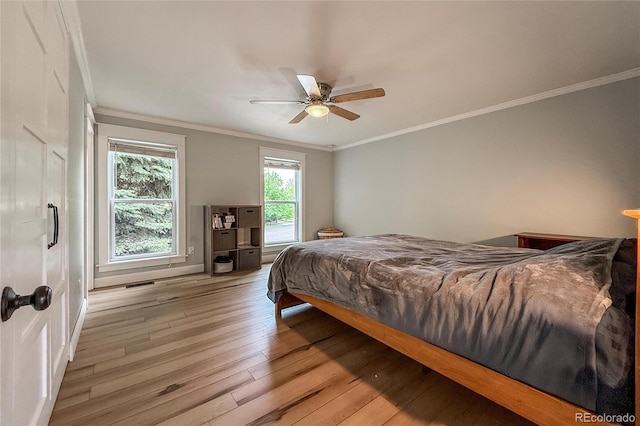 117 Sandler Dr, Lafayette, CO 80026 - bedroom featuring hardwood / wood-style flooring, ornamental molding, and ceiling fan