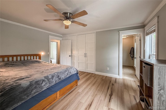 117 Sandler Dr, Lafayette, CO 80026 - bedroom with light wood-type flooring, baseboards, crown molding, ceiling fan, and a closet