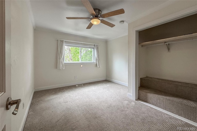 117 Sandler Dr, Lafayette, CO 80026 - unfurnished bedroom with crown molding, carpet flooring, baseboards, a closet, and a ceiling fan