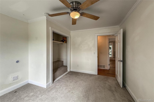 117 Sandler Dr, Lafayette, CO 80026 - unfurnished bedroom featuring carpet flooring, crown molding, baseboards, a closet, and a ceiling fan