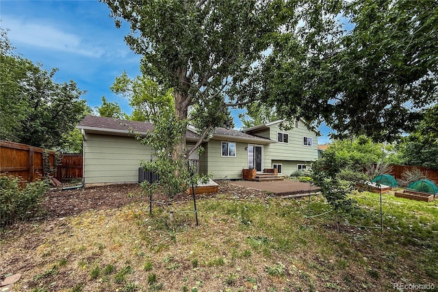 117 Sandler Dr, Lafayette, CO 80026 - rear view of house with a fenced backyard and a patio area