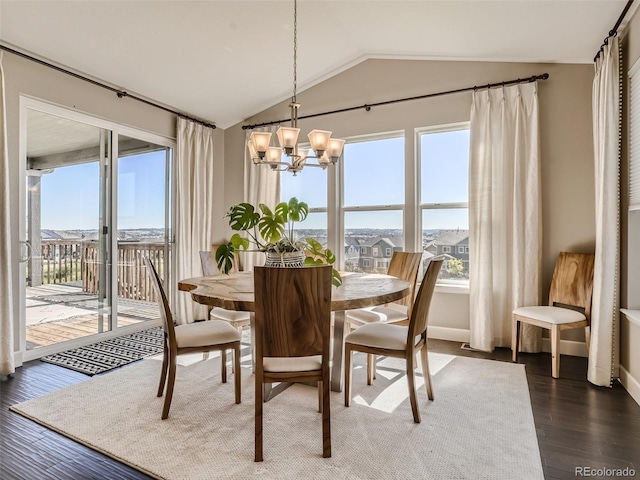 11096 Endeavor Dr, Parker, CO 80134 - dining area featuring vaulted ceiling, a chandelier, and dark wood-style floors