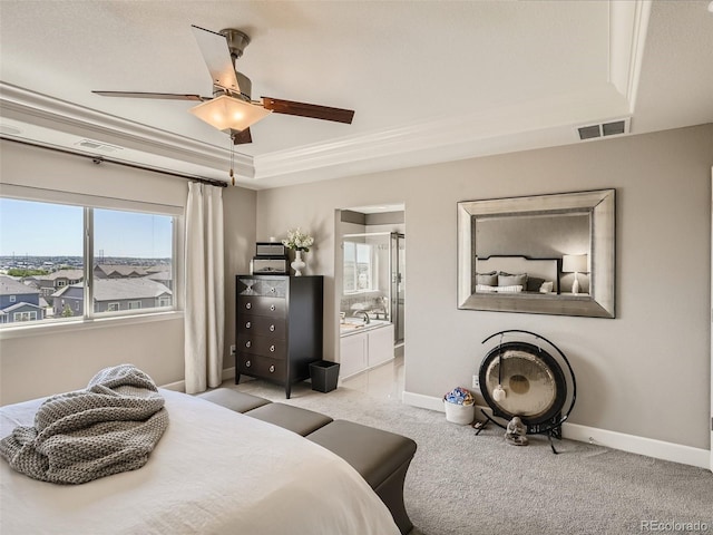 11096 Endeavor Dr, Parker, CO 80134 - bedroom featuring a tray ceiling, multiple windows, and baseboards
