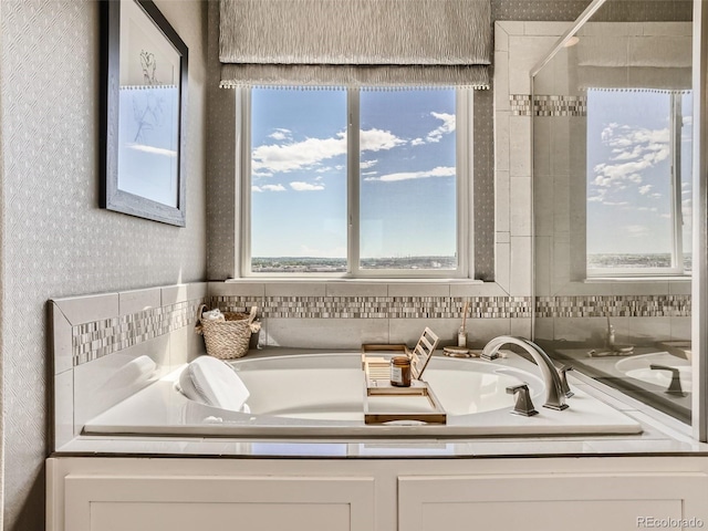 11096 Endeavor Dr, Parker, CO 80134 - full bath with wallpapered walls and a tub to relax in