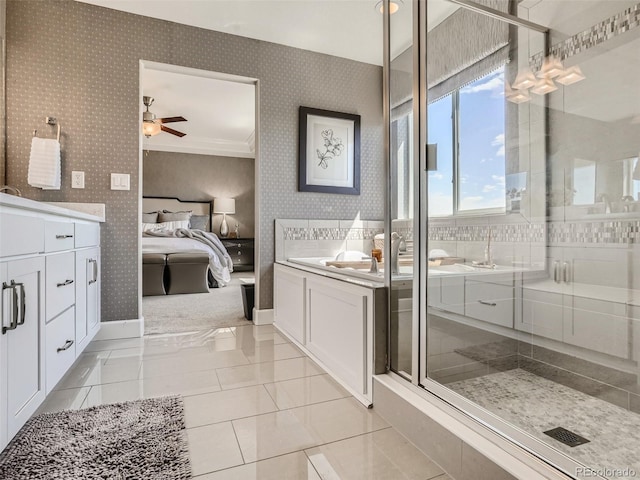 11096 Endeavor Dr, Parker, CO 80134 - ensuite bathroom featuring wallpapered walls, vanity, baseboards, ceiling fan, and a stall shower
