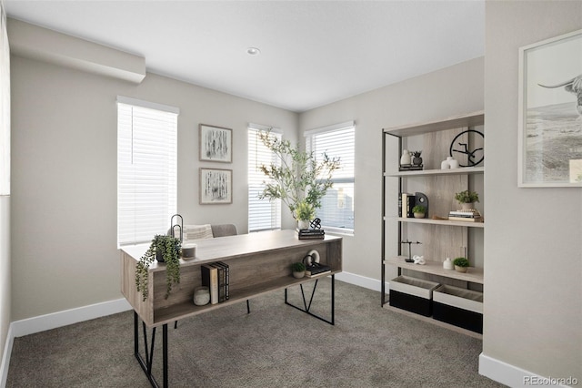 carpeted office featuring baseboards