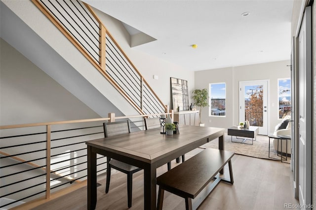dining space with wood finished floors