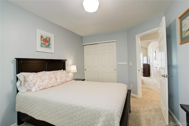 12671 Meadow Bridge Way, Parker, CO 80134 - bedroom with light colored carpet, a closet, and baseboards