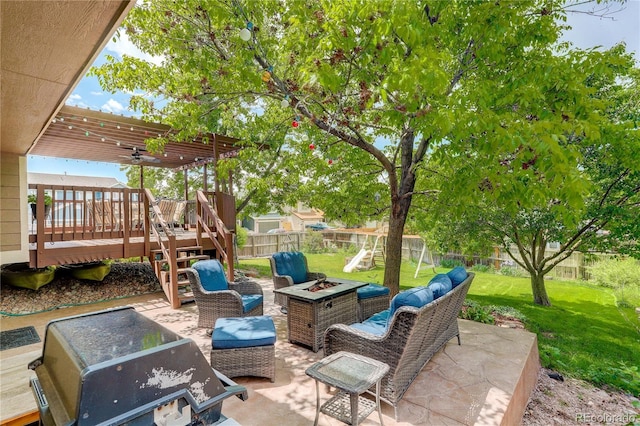 12671 Meadow Bridge Way, Parker, CO 80134 - view of patio with a deck, a ceiling fan, and an outdoor living space with a fire pit