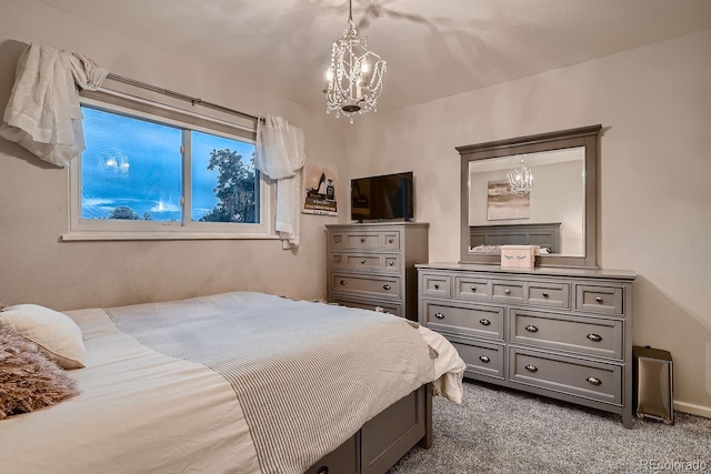 carpeted bedroom featuring an inviting chandelier