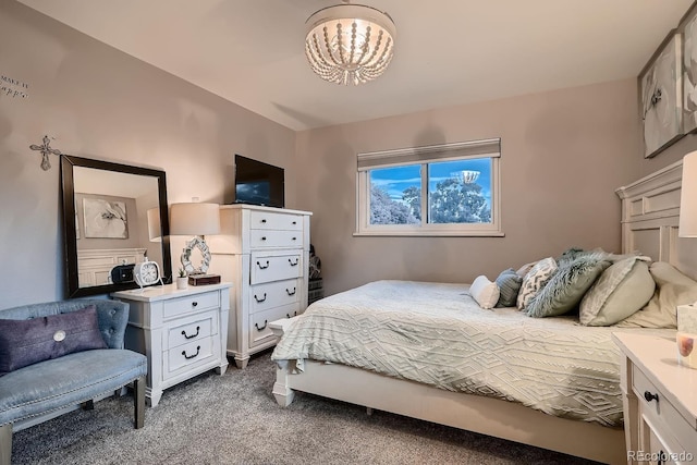 bedroom with carpet flooring and an inviting chandelier