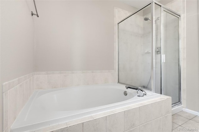 9898 Tourmaline Ct, Parker, CO 80134 - full bathroom with a stall shower, a garden tub, and tile patterned floors
