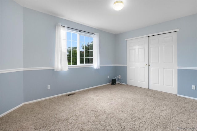 9898 Tourmaline Ct, Parker, CO 80134 - unfurnished bedroom with carpet, a closet, and baseboards