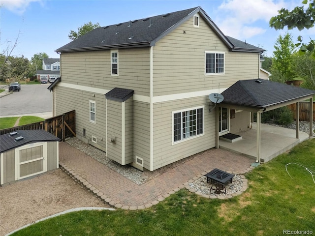 9898 Tourmaline Ct, Parker, CO 80134 - back of property featuring a patio, a fire pit, and roof with shingles
