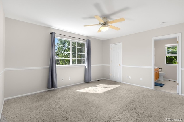 9898 Tourmaline Ct, Parker, CO 80134 - unfurnished bedroom with carpet, baseboards, ensuite bathroom, and ceiling fan