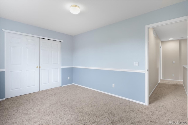 9898 Tourmaline Ct, Parker, CO 80134 - unfurnished bedroom with carpet floors, baseboards, and a closet