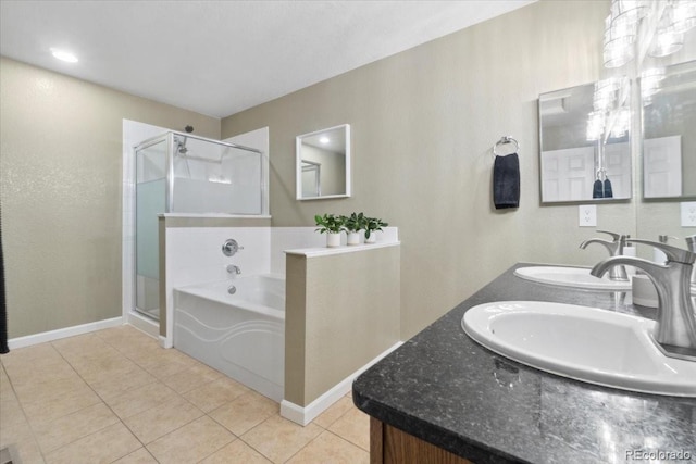 1761 S Buchanan Cir, Aurora, CO 80018 - bathroom featuring a bath, tile patterned flooring, a shower stall, and a sink
