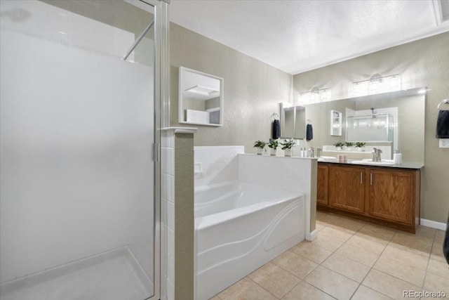 1761 S Buchanan Cir, Aurora, CO 80018 - bathroom featuring a stall shower, a sink, tile patterned floors, a garden tub, and double vanity