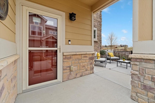 1761 S Buchanan Cir, Aurora, CO 80018 - property entrance with covered porch and stone siding