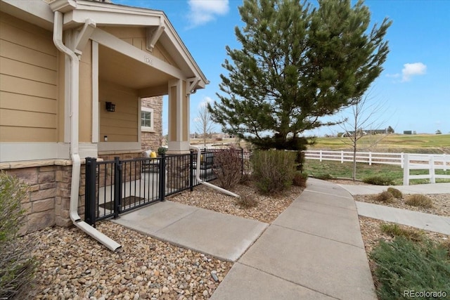 1761 S Buchanan Cir, Aurora, CO 80018 - exterior space featuring covered porch, fence, and a gate