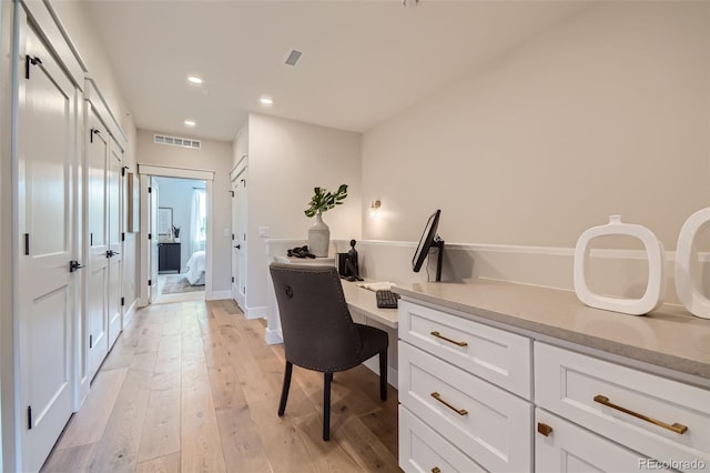 home office featuring light hardwood / wood-style floors