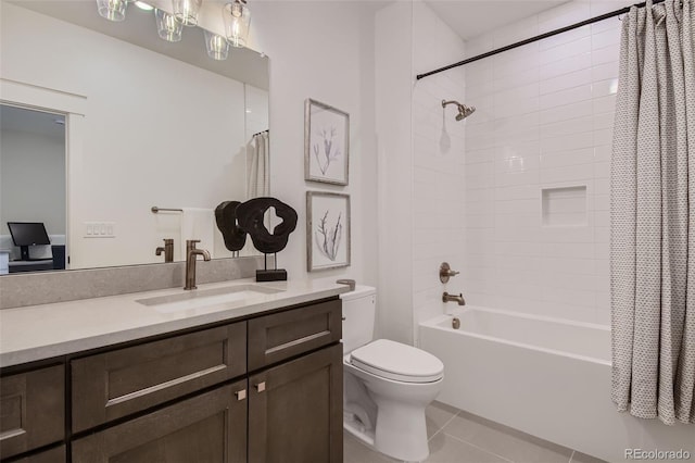 full bathroom featuring tile patterned flooring, vanity, toilet, and shower / tub combo