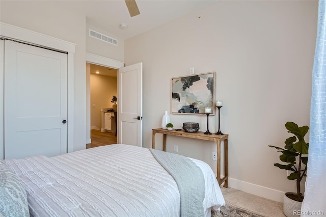 bedroom featuring carpet flooring, ceiling fan, and a closet