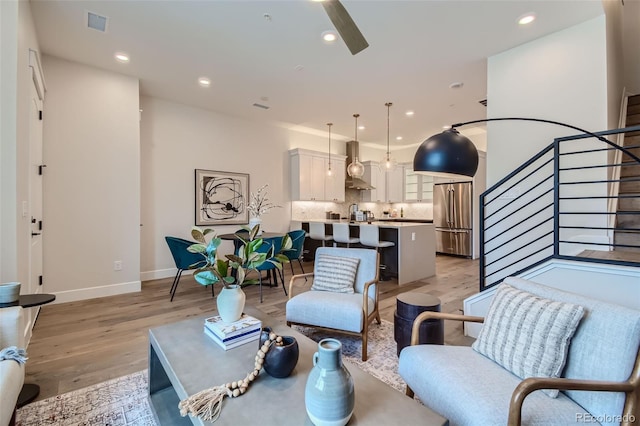 living room with light hardwood / wood-style flooring