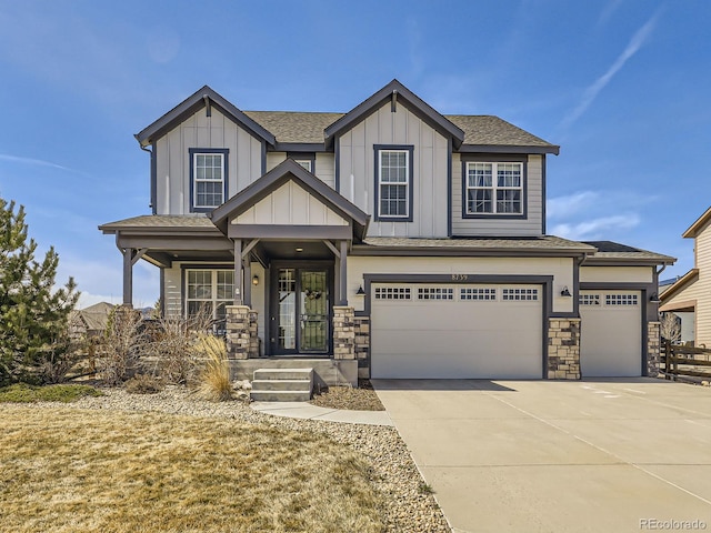 craftsman inspired home with concrete driveway, covered porch, board and batten siding, and a shingled roof