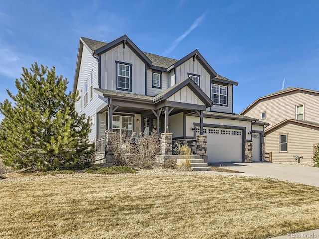 view of front of property featuring a porch, concrete driveway, a garage, stone siding, and board and batten siding