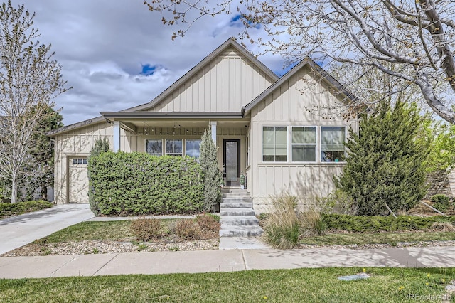19 S 45th Ave, Brighton, CO 80601 - view of front of house featuring concrete driveway, board and batten siding, and an attached garage
