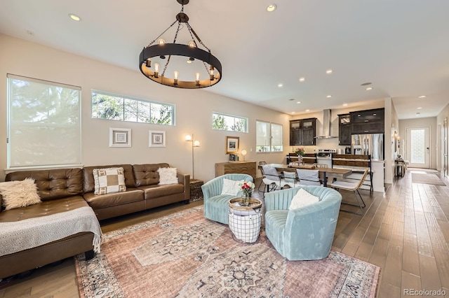 19 S 45th Ave, Brighton, CO 80601 - living room with recessed lighting, a chandelier, a healthy amount of sunlight, and hardwood / wood-style flooring