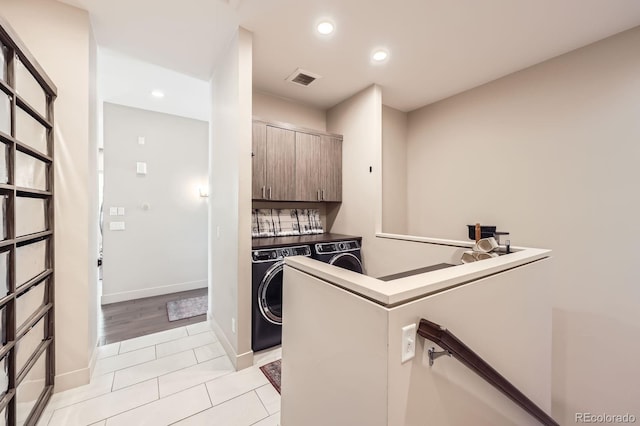 19 S 45th Ave, Brighton, CO 80601 - laundry area featuring cabinet space, light tile patterned flooring, recessed lighting, and independent washer and dryer