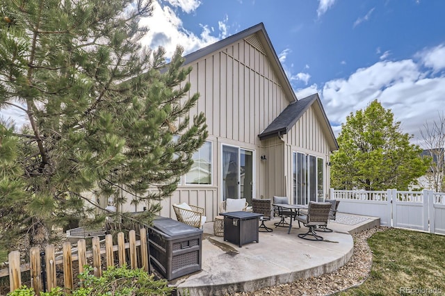 19 S 45th Ave, Brighton, CO 80601 - rear view of property with a patio, board and batten siding, and fence private yard