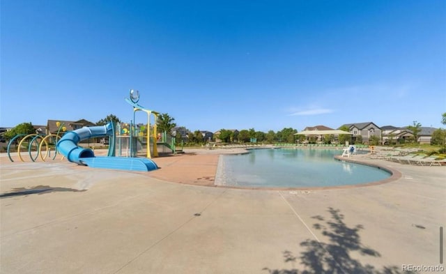 19 S 45th Ave, Brighton, CO 80601 - community pool with a patio area and a water slide