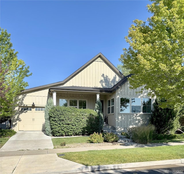 19 S 45th Ave, Brighton, CO 80601 - view of front of house with an attached garage, concrete driveway, and board and batten siding