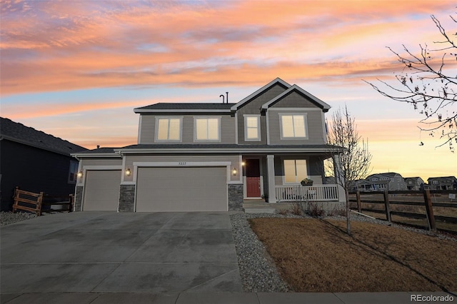 view of front of property featuring a garage and covered porch