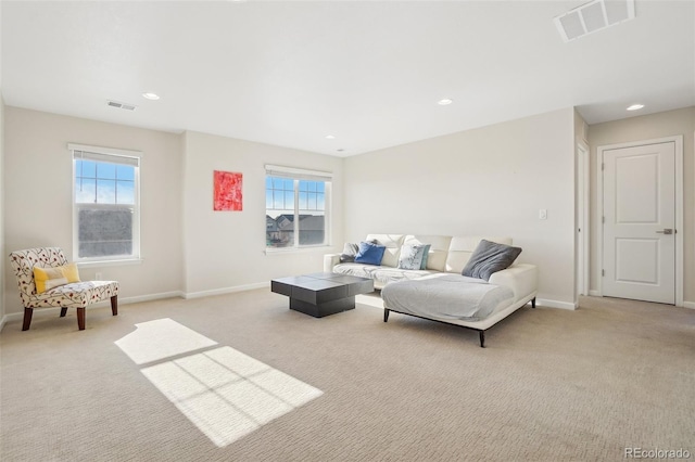 living room with light colored carpet