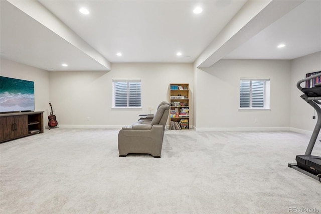 exercise room with light colored carpet