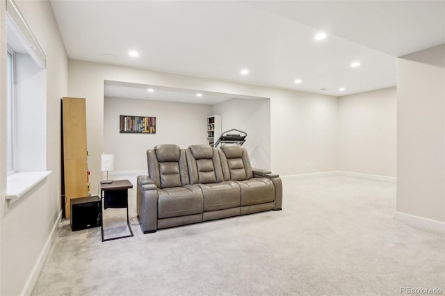 home theater with light colored carpet