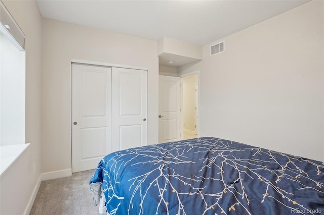 carpeted bedroom with a closet