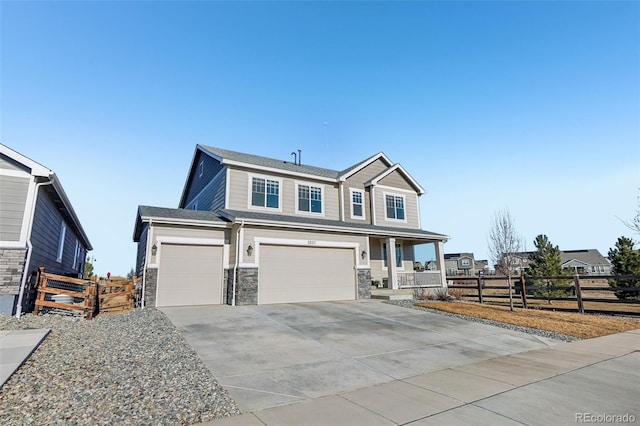 view of front of house with a garage and a porch