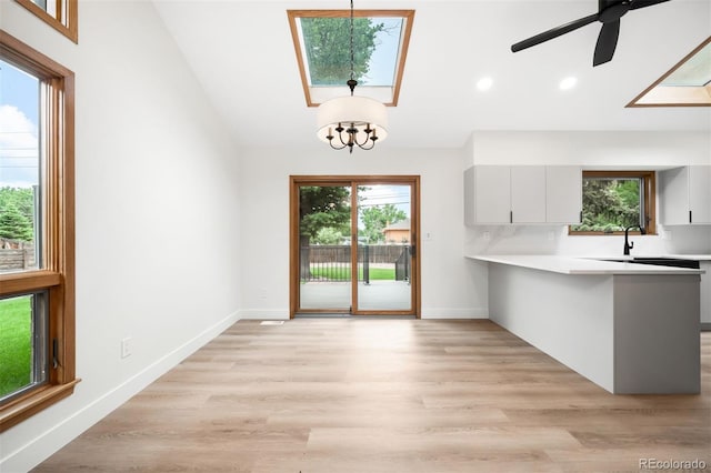 655 Cree Cir, Boulder, CO 80303 - unfurnished dining area featuring recessed lighting, a ceiling fan, light wood-type flooring, lofted ceiling, and a skylight