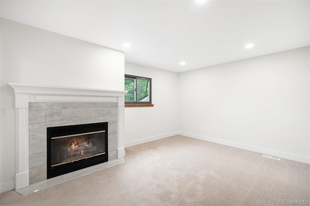 655 Cree Cir, Boulder, CO 80303 - unfurnished living room with carpet floors, a tile fireplace, and recessed lighting