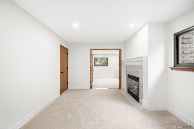 655 Cree Cir, Boulder, CO 80303 - unfurnished living room featuring a fireplace, light colored carpet, and recessed lighting